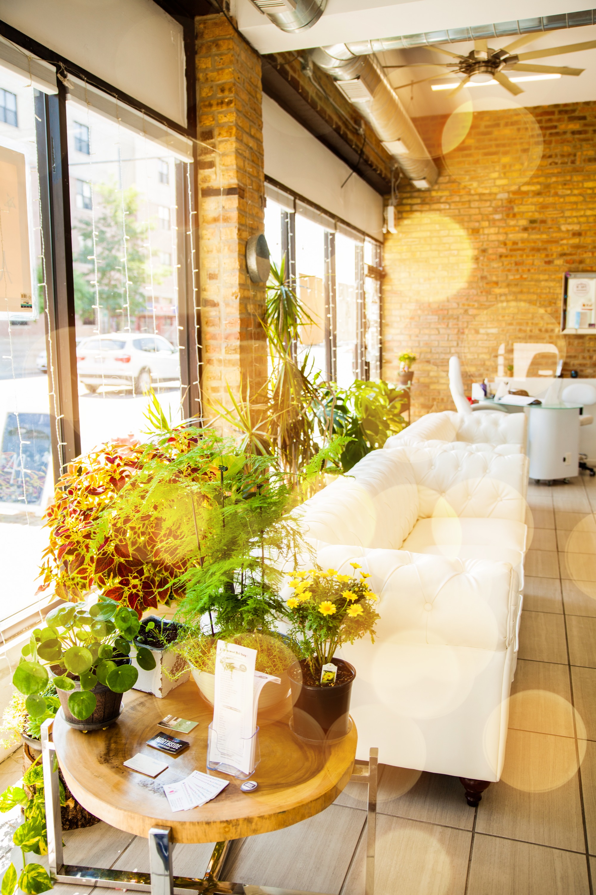 Woman getting manicure in nail salon